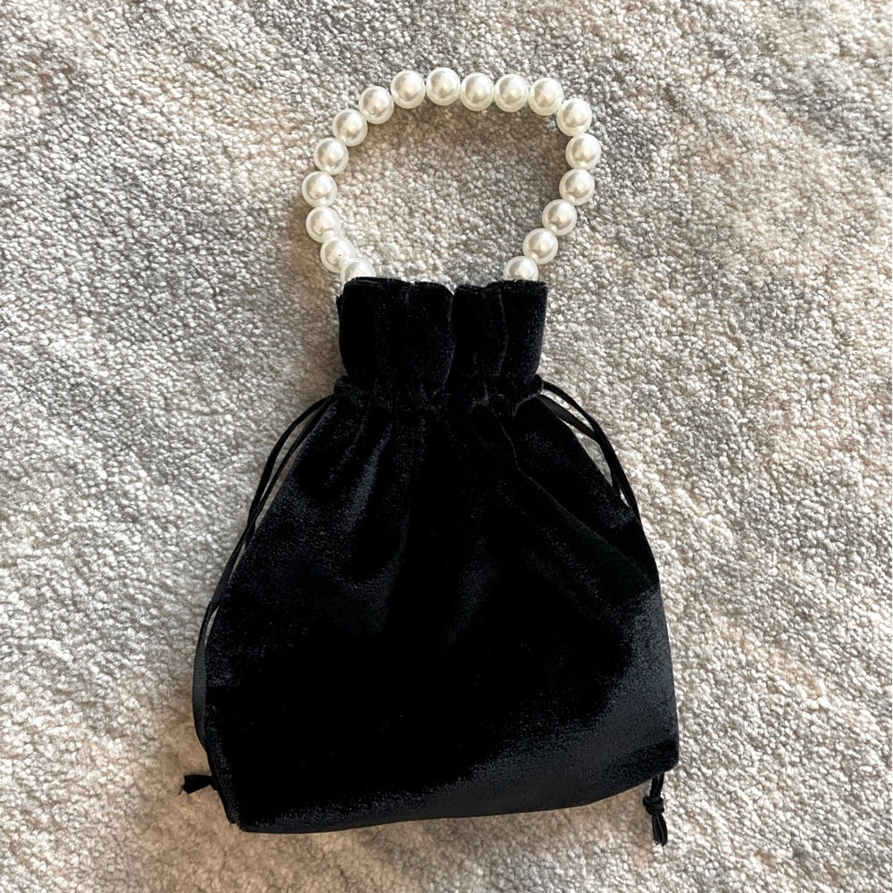 Ring Concierge clutch/purse. Black velvet with pearl handle.